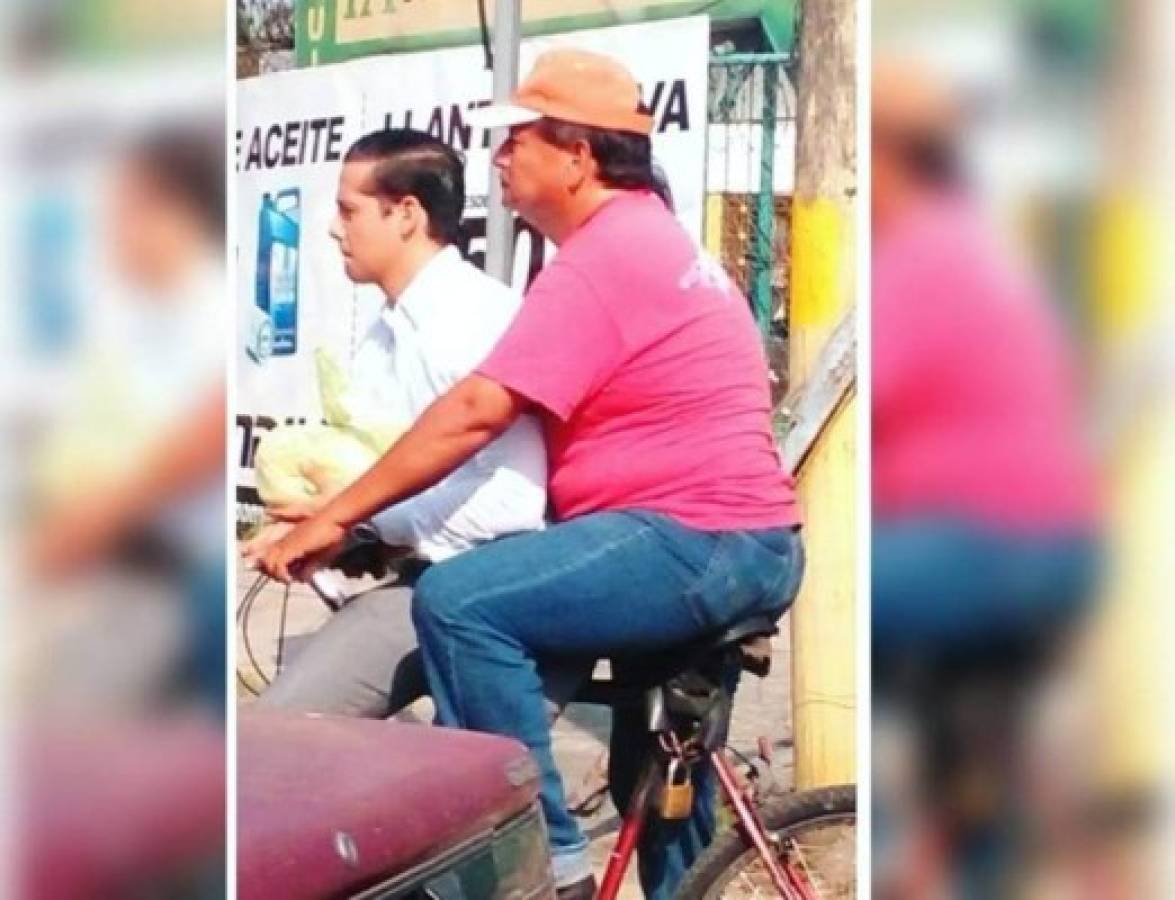 Padre hondureño lleva diariamente en bicicleta a su hijo al trabajo