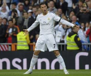 TOPSHOTSReal Madrid's Portuguese forward Cristiano Ronaldo celebrates after scoring during the Spanish league football match Real Madrid CF vs CA Osasuna at the Santiago Bernabeu stadium in Madrid on April 26, 2014. AFP PHOTO / PEDRO ARMESTRE