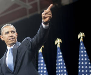 US President Barack Obama points to the crowd after delivering remarks on immigration reform at Del Sol High School in Las Vegas, NV, January 29, 2013. Obama Tuesday hailed a 'genuine desire' among warring US politicians to pursue immigration reform, ahead of a speech laying out his own approach to the politically fiery issue. AFP PHOTO/Jim WATSON