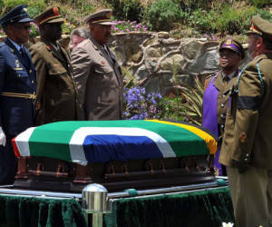 This handout photo taken and released by the Government Communication and Information System (GCIS) shows the coffin of South African former President Nelson Mandela at his burial site on December 13, 2013 in Qunu. Mandela, the revered icon of the anti-apartheid struggle in South Africa and one of the towering political figures of the 20th century, died in Johannesburg on December 5 at age 95. AFP PHOTO / EDMOND JIYANE