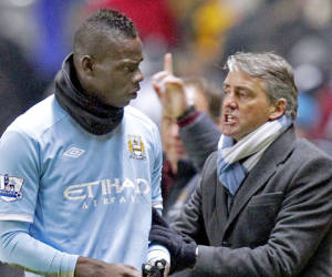 (Files) In this file picture taken on December 26, 2010 Manchester City's Italian manager Roberto Mancini (R) clashes with his Italian striker Mario Balotelli after their English Premier League football match against Newcastle United at St James' Park, Newcastle-Upon-Tyne, north-east England. Mario Balotelli's future at Manchester City was cast into doubt once again on Thursday, January 3, 2013 after photographs emerged showing him in an apparent training-ground bust-up with manager Roberto Mancini. Media reports claimed that Mancini lost his temper with his Italian compatriot after Balotelli made a reckless challenge on team-mate Scott Sinclair at the club's Carrington training base on the edge of Manchester. The pictures, published widely in the British media, show Mancini gripping Balotelli's orange bib in an apparent rage, before the two men are separated by members of City's coaching staff. AFP PHOTO/GRAHAM STUARTFOR EDITORIAL USE ONLY Additional licence required for any commercial/promotional use or use on TV or internet (except identical online version of newspaper) of Premier League/Football League photos. Tel DataCo +44 207 2981656. Do not alter/modify photo.