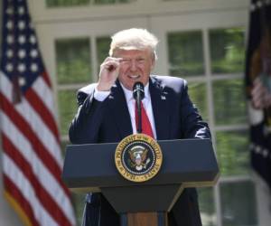 Trump firmó su primera orden ejecutiva sobre inmigración una semana después de asumir la presidencia en enero. Foto: AFP