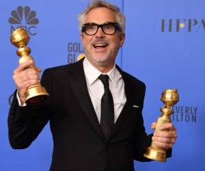 Alfonso Cuarón ganó dos Golden Globes con un retrato en blanco y negro de su infancia, Roma. Foto AFP