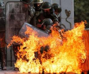 Este día fue un viernes más de manifestaciones que dan vida a una revuelta social que superó los tres meses y sigue latiendo en las calles de Chile. Fotos: AFP.