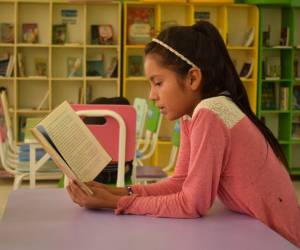 Plan International Honduras continúa impulsando su modelo de bibliotecas en beneficio de los niños y las niñas del occidente del país.