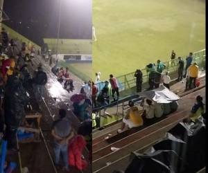 Momento en que aficionados se vieron afectados por las lluvias en el Juan Ramón Brevé.