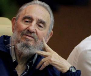 (FILES) File photo dated on February, 2002 of Castro's elder son, nuclear physicist Fidel Castro Diaz-Balart (R), next to his father, Cuban leader Fidel Castro, during the Havana Book Fair opening.Fidel Castro's eldest son committed suicide: Cuba state media on February 1, 2018. / AFP PHOTO / Adalberto ROQUE