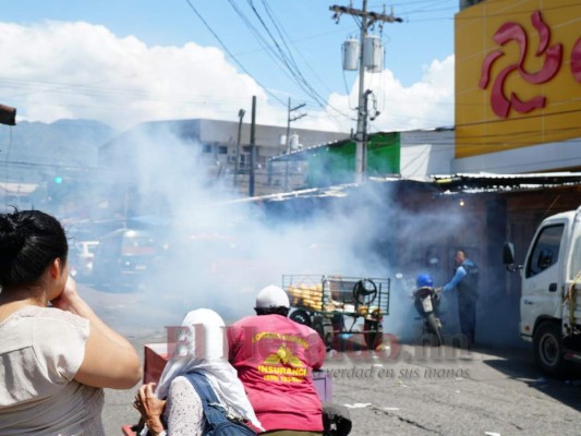 FOTOS: Así capturaron a mujer que quedó encerrada en negocio durante saqueos en San Pedro Sula