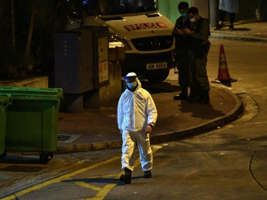 FOTOS: Rigurosa inspección en Hong Kong tras infección en cena familiar