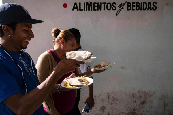 FOTOS: La agridulce celebración de los migrantes en la frontera de México con EEUU