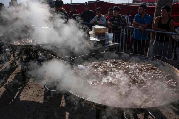 FOTOS: La agridulce celebración de los migrantes en la frontera de México con EEUU