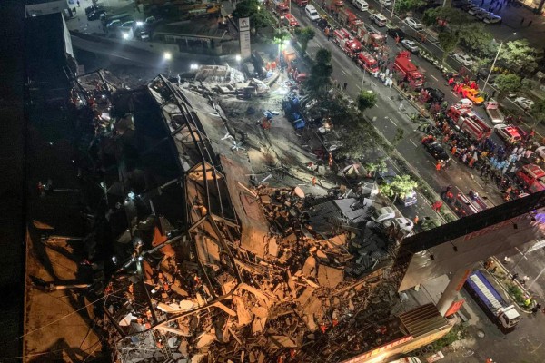 FOTOS: Ardua búsqueda de sobrevivientes de hotel colapsado en China