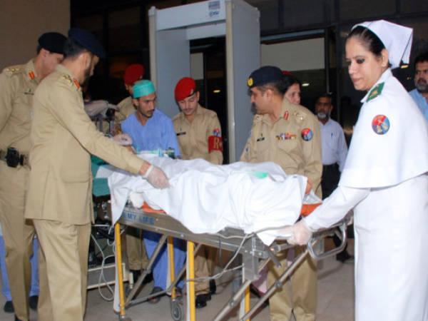 This handout photograph released by the Pakistan's Inter Services Public Relations (ISPR) on October 15, 2012, shows a Pakistani army medical team transporting child activist Malala Yousufzai on a stretcher from a military hospital to an air ambulance in Rawalpindi. A teenage Pakistani rights activist was flown to Britain for specialist long-term care on October 15 after being shot in the head by the Taliban for campaigning for the right to education. Malala Yousafzai, 14, who was attacked on her school bus in the former Taliban stronghold of the Swat valley last Tuesday, was sent abroad at a time when her condition is 'optimal and before any unforeseen complications set in', the military said. AFP PHOTO / INTER SERVICES PUBLIC RELATIONS -----EDITORS NOTE---- RESTRICTED TO EDITORIAL USE MANDATORY CREDIT 'AFP PHOTO / INTER SERVICES PUBLIC RELATIONS' ---- NO MARKETING NO ADVERTISING CAMPAIGNS - DISTRIBUTED AS A SERVICE TO CLIENTS