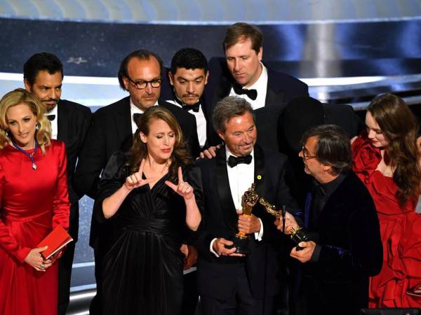 Coda cast and crew accept the award for Best Picture for CODA onstage during the 94th Oscars at the Dolby Theatre in Hollywood, California on March 27, 2022. (Photo by Robyn Beck / AFP)