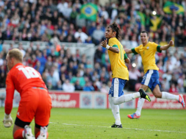 Brazil's Neymar, center, celebrates his goal during their Olympic Men's friendly soccer match against Great Britain at the Riverside Stadium, Middlesbrough, England, Friday, July. 20, 2012. (AP Photo/Scott Heppell)