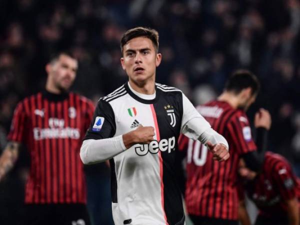 Juventus' Argentine forward Paulo Dybala (C) celebrates after opening the scoring during the Italian Serie A football match Juventus vs AC Milan on November 10, 2019 at the Juventus Allianz stadium in Turin. (Photo by Marco Bertorello / AFP)