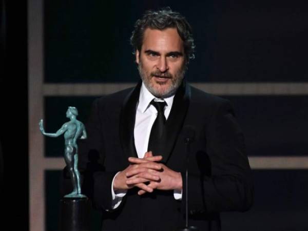 TOPSHOT - US actor Joaquin Phoenix accepts the award for Outstanding Performance by a Male Actor in a Leading Role during the 26th Annual Screen Actors Guild Awards show at the Shrine Auditorium in Los Angeles on January 19, 2020. (Photo by Robyn Beck / AFP)