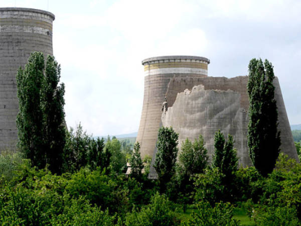 A general view of the damaged cooler tower of the Pernik's thermal power plant taken on May 22, 2012 in the town of Pernik, after an earthquake, measuring 5.8 on the open-ended Richter scale. The quake rocked Bulgaria shortly after 3:00 am (0000 GMT), Bulgaria’s Seismological Institute said on May 22. The US Geological Survey said earlier the quake hit at a depth of 9.1 kms (5.7 miles), 24 kms (14 miles) west of Sofia. The quake jolted the town of Pernik, about 30 kms (20 miles) southwest of Sofia, causing some tall buildings to sway, and was followed by about 15 lighter aftershocks. AFP PHOTO / NIKOLAY DOYCHINOV