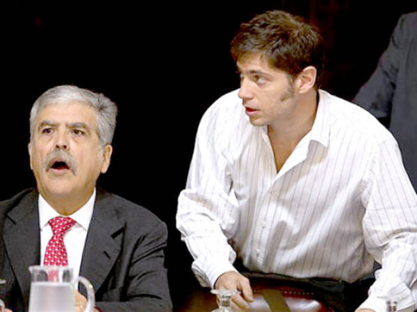 Argentina's Planning Minister Julio De Vido, left, and Vice Economy Minister Axel Kicillof, who were appointed by President Cristina Fernandez to handle the expropriation of the YPF oil company, arrive to Congress which is discussing a bill proposed by Fernandez to gain control of Argentina's energy reserves in Buenos Aires, Argentina, Tuesday April 17, 2012. Fernandez pushed forward a bill to renationalize the country's largest oil company on Monday despite fierce criticism from abroad and the risk of a major rift with Spain. Fernandez said the legislation put to congress would give Argentina a majority stake in oil and gas company YPF by taking control of 51 percent of its shares currently held by Spain's Repsol. (AP Photo/Natacha Pisarenko)