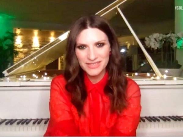 En esta imagen difundida el domingo 28 de febrero de 2021 por NBC, Laura Pausini acepta el Globo de Oro a la mejor canción original como coautora de “Io Sì”, tema central de la película “La vita davanti a sé”. Foto: AP