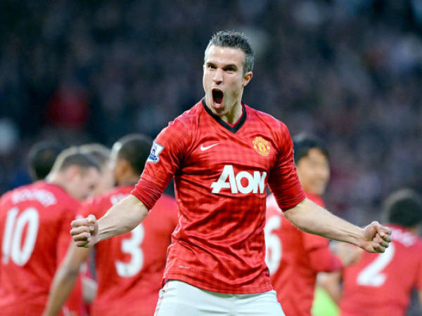 Manchester United's Dutch striker Robin van Persie celebrates scoring his team's first goal against Aston Villa during the English Premier League football match between Manchester United and Aston Villa at Old Trafford in Manchester, northwest England, on April 22, 2013. AFP PHOTO / PAUL ELLISRESTRICTED TO EDITORIAL USE. No use with unauthorized audio, video, data, fixture lists, club/league logos or “live” services. Online in-match use limited to 45 images, no video emulation. No use in betting, games or single club/league/player publications.