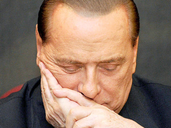 (FILES) - A file picture taken on February 1, 2012 at the Italian parliament in Rome shows Italy's former Prime Minister Silvio Berlusconi who has been sentenced to a year in prison on March 7, 2013, over the publication of leaked transcripts from a police wiretap in a newspaper that he owns. An Italian court on May 8, 2013 upheld a tax fraud conviction for former prime minister Silvio Berlusconi, confirming his sentence of one year in prison and a five-year ban from public office. AFP PHOTO / ANDREAS SOLARO