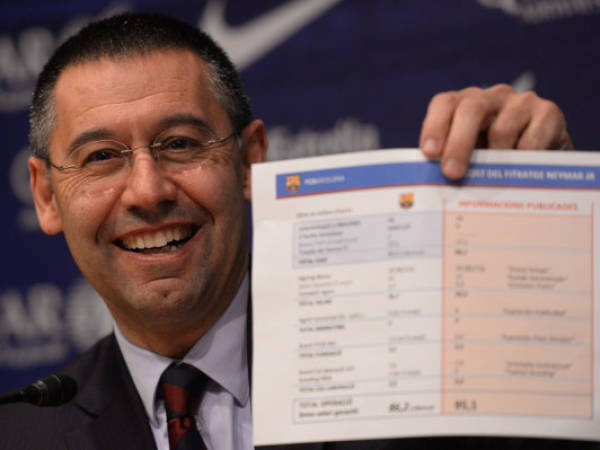 FC Barcelona's president Josep Maria Bartomeu shows a paper with detaitls of the contract of Neymar at the Camp Nou stadium in Barcelona, Spain, Friday, Jan 24, 2014. Barcelona says its board of directors is calling an ''extraordinary'' meeting, fueling Spanish media reports that club president Sandro Rosell is under pressure to consider stepping down due to the lawsuit regarding Neymar's transfer. Barcelona said in a statement that the meeting will take place on Thursday afternoon, a day after a judge agreed to hear a lawsuit brought by a Barcelona club member over the cost of Neymar's signing. (AP Photo/Manu Fernandez)