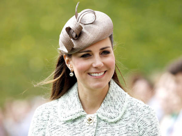 (Fies) In this file picture taken on April 21, 2013 Britain's Catherine, Duchess of Cambridge, attends the National Review of Queen's Scouts at Windsor Castle in Berkshire. Prince William's wife Catherine was admitted today, Monday July 22, 2013 to a private wing of St Mary's Hospital in Paddington, central London, to give birth to her first child. AFP PHOTO / POOL / OLIVIA HARRIS