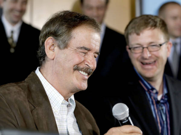 Former Mexican President Vicente Fox, left, speaks as Jamen Shively, CEO of Diego Pellicer, looks on during a news conference Thursday, May 30, 2013, in Seattle. Diego Pellicer Inc. announced recent acquisitions of medical marijuana dispensary chains in Washington and Colorado, creating the first national brand of retail cannabis. Diego also spoke about plans to expand across the United States and internationally, and to become the market leader in both medical and adult-use marijuana. (AP Photo/Elaine Thompson)