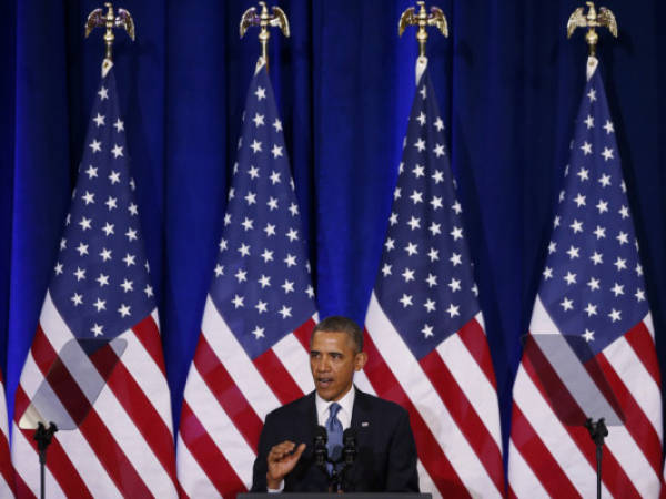 President Barack Obama speaks about National Security Agency (NSA) surveillance, Friday, Jan. 17, 2014, at the Justice Department in Washington. Seeking to calm a furor over U.S. surveillance, President Barack Obama on Friday called for ending the government's control of phone data from hundreds of millions of Americans and immediately ordered intelligence agencies to get a secretive court's permission before accessing such records. (AP Photo/Charles Dharapak)