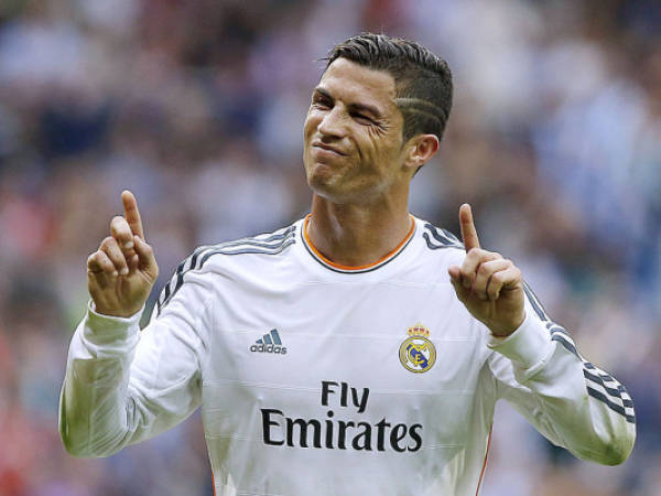 Real Madrid's Cristiano Ronaldo celebrates his goal during a Spanish La Liga soccer match against Malaga at the Santiago Bernabeu stadium in Madrid, Spain, Saturday, Oct. 19, 2013. (AP Photo/Andres Kudacki)