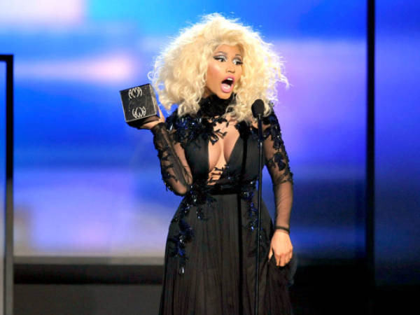 Nicki Minaj accepts the award for favorite artist - rap/hip-hop at the 40th Anniversary American Music Awards on Sunday, Nov. 18, 2012, in Los Angeles. (Photo by John Shearer/Invision/AP)