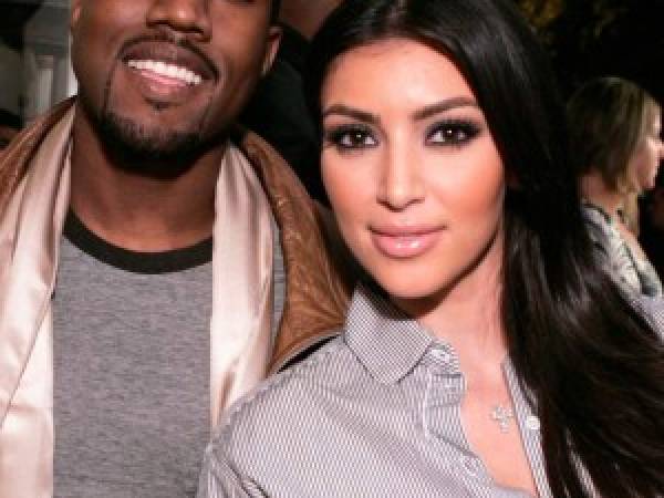 LOS ANGELES - SEPTEMBER 25: Music recording artist Kanye West, left, and socialite Kim Kardashian attend the grand opening of Intermix on September 25, 2007 in Los Angeles, California. (Photo by Chris Weeks/WireImage)