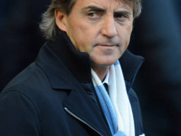 Manchester City's Italian manager Roberto Mancini looks on before the fifth round English FA Cup football match between Manchester City and Leeds United at the Etihad Stadium in Manchester on February 17, 2013. AFP PHOTO/ANDREW YATESRESTRICTED TO EDITORIAL USE. No use with unauthorized audio, video, data, fixture lists, club/league logos or live services. Online in-match use limited to 45 images, no video emulation. No use in betting, games or single club/league/player publications.