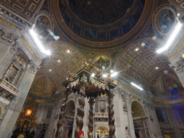 A general view shows St Peter's Basilica during a papal mass Pope on Christmas Eve to mark the nativity of Jesus Christ, on December 24, 2013 at the Vatican. AFP PHOTO / FILIPPO MONTEFORTE