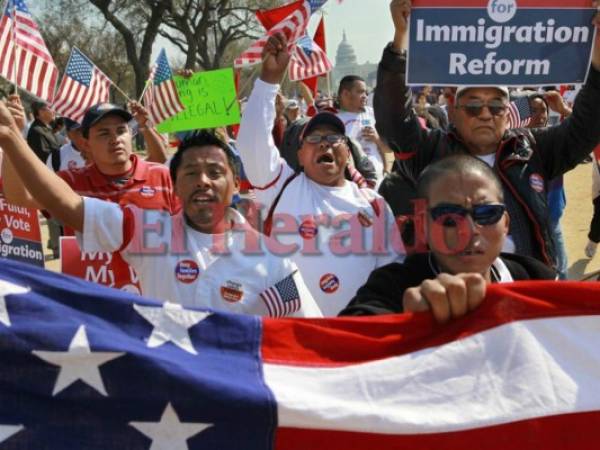 With the Capitol in the background, farm workers from West Palm Beach, Fla., march and chant while attending a rally for immigration reform where tens of thousands of people were expected on the National Mall in Washington, on Sunday, March 21, 2010. (AP Photo/Jacquelyn Martin)