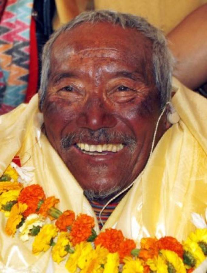 FILE - In this May 31, 2008 file photo, Min Bahadur Sherchan, who became the oldest person to climb Mount Everest on May 25, 2008, smiles upon his arrival in Katmandu, Nepal. Officials say Sherchan who was attempting to scale Mount Everest to regain his title as the oldest person to scale the world’s highest peak has died at the base camp on Saturday, May 6, 2017, but was not clear about the cause of the death. The grandfather of 17 and great-grandfather of six first scaled Everest in May 2008, when he was 76 and at the time declared the oldest climber. His record was broken by then 80-year-old Japanese Yuichiro Miura in 2013(AP Photo/Binod Joshi, File)