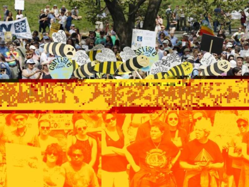 People gather for a climate rally on Boston Common in Boston, Saturday, April 29, 2017. Organizers say they’re marking President Donald Trump’s first 100 days in office by protesting his agenda so far. (AP Photo/Michael Dwyer)